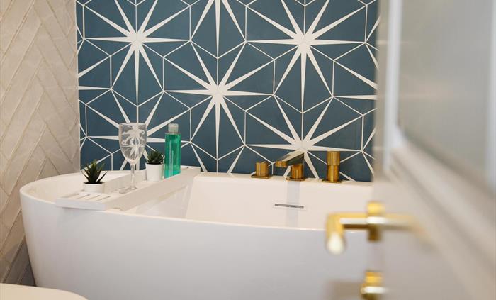 free standing bath, heated towel rail, wc, basin, and bluetooth mirror - on the first floor